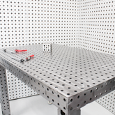 Metal workbench with tools on a white background